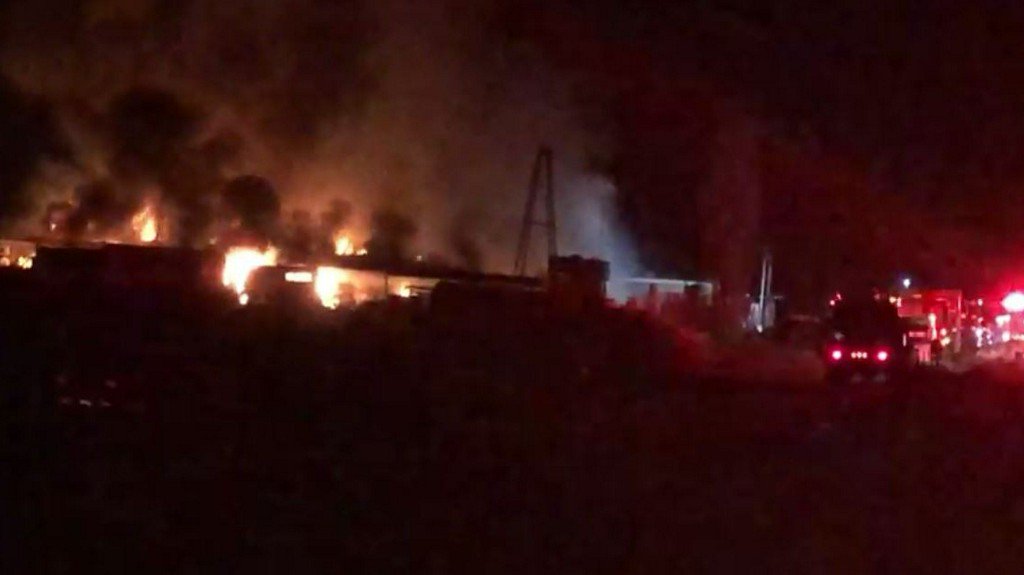The Bernalillo County Fire Department is fighting a large fire in the Pajarito Mesa that has destroyed one mobile home and ignited the surrounding dry grass and brush. Several firefighting agencies are assisting with the blaze, which began around 6 p.m.
